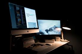 Modern workspace with dual monitors used for digital growth strategy work